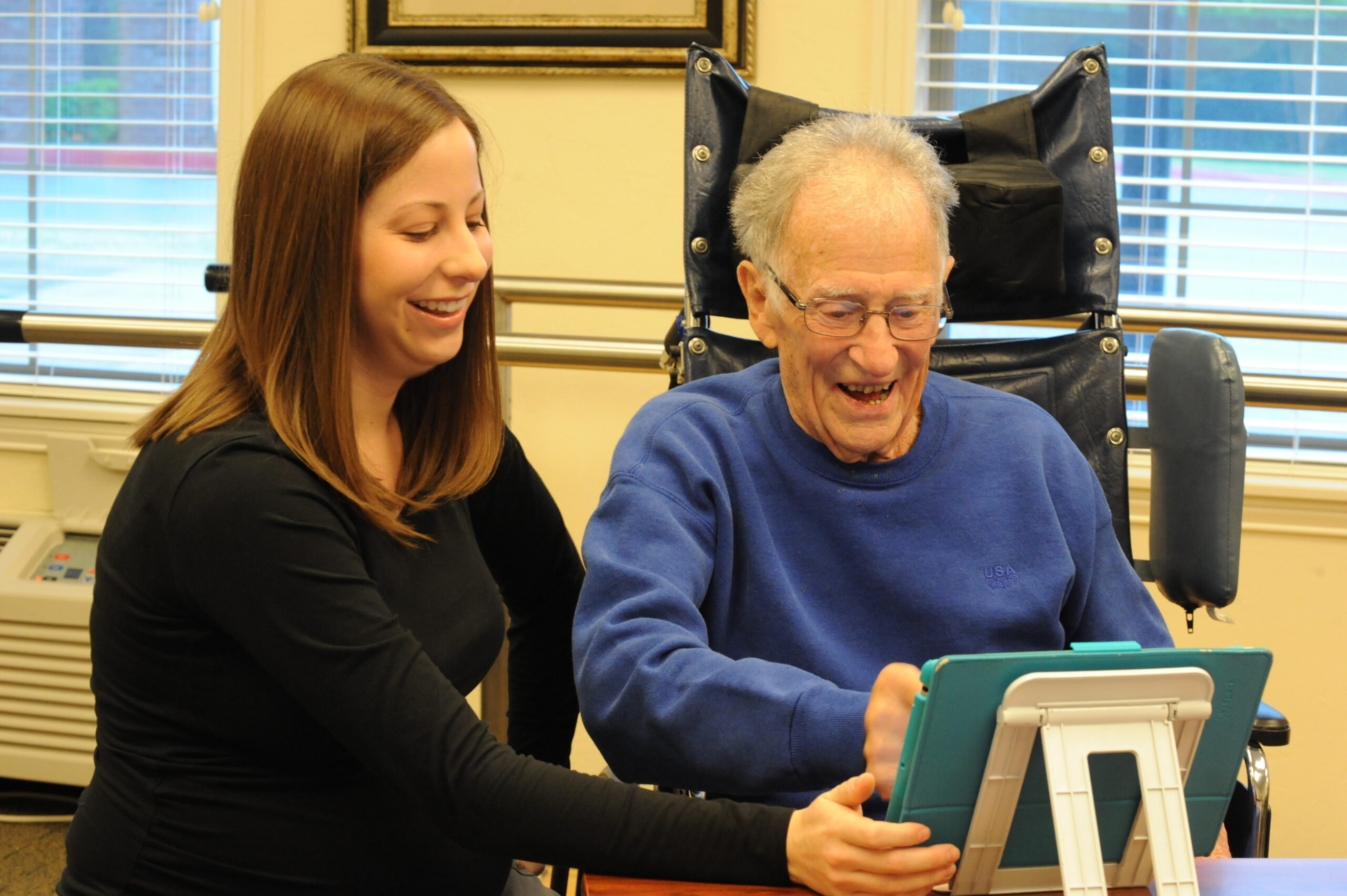 a nurse working on a tablet with a concordia resident