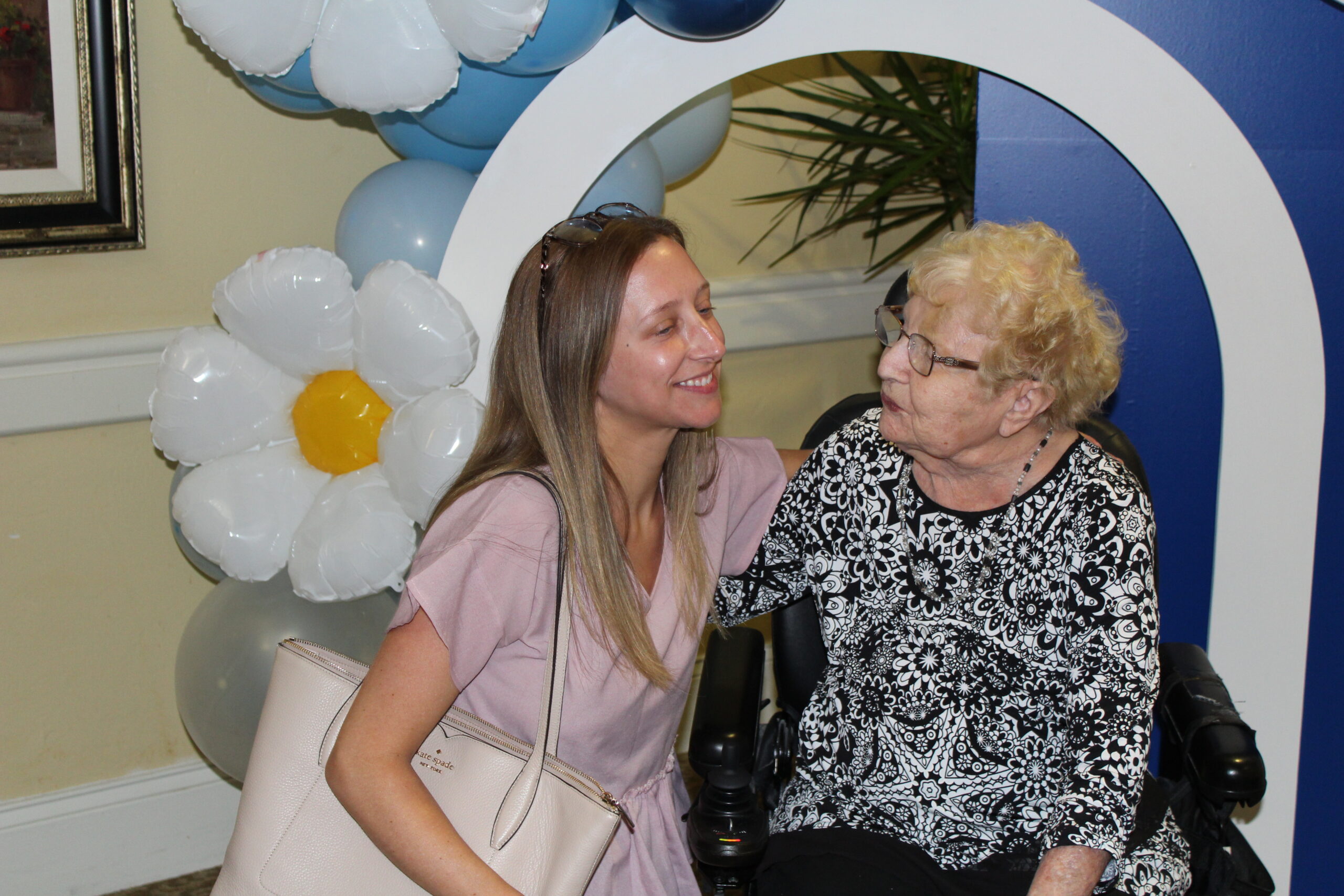 a family member posing with a concordia resident