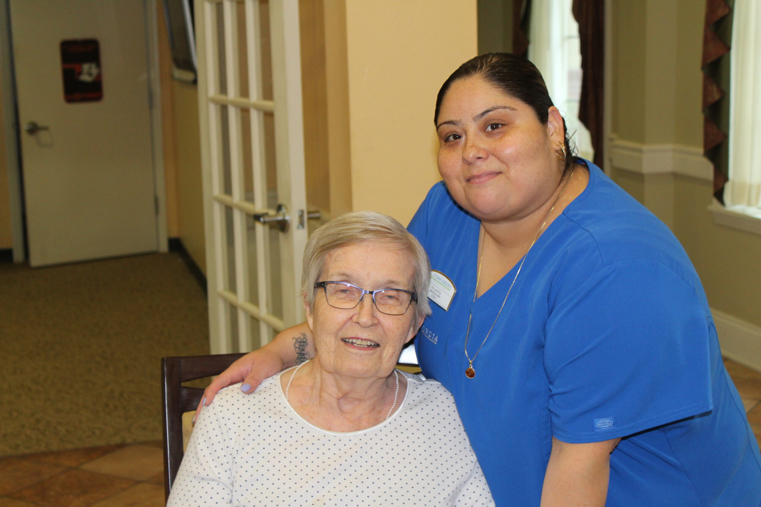 a nurse posing with a concordia resident