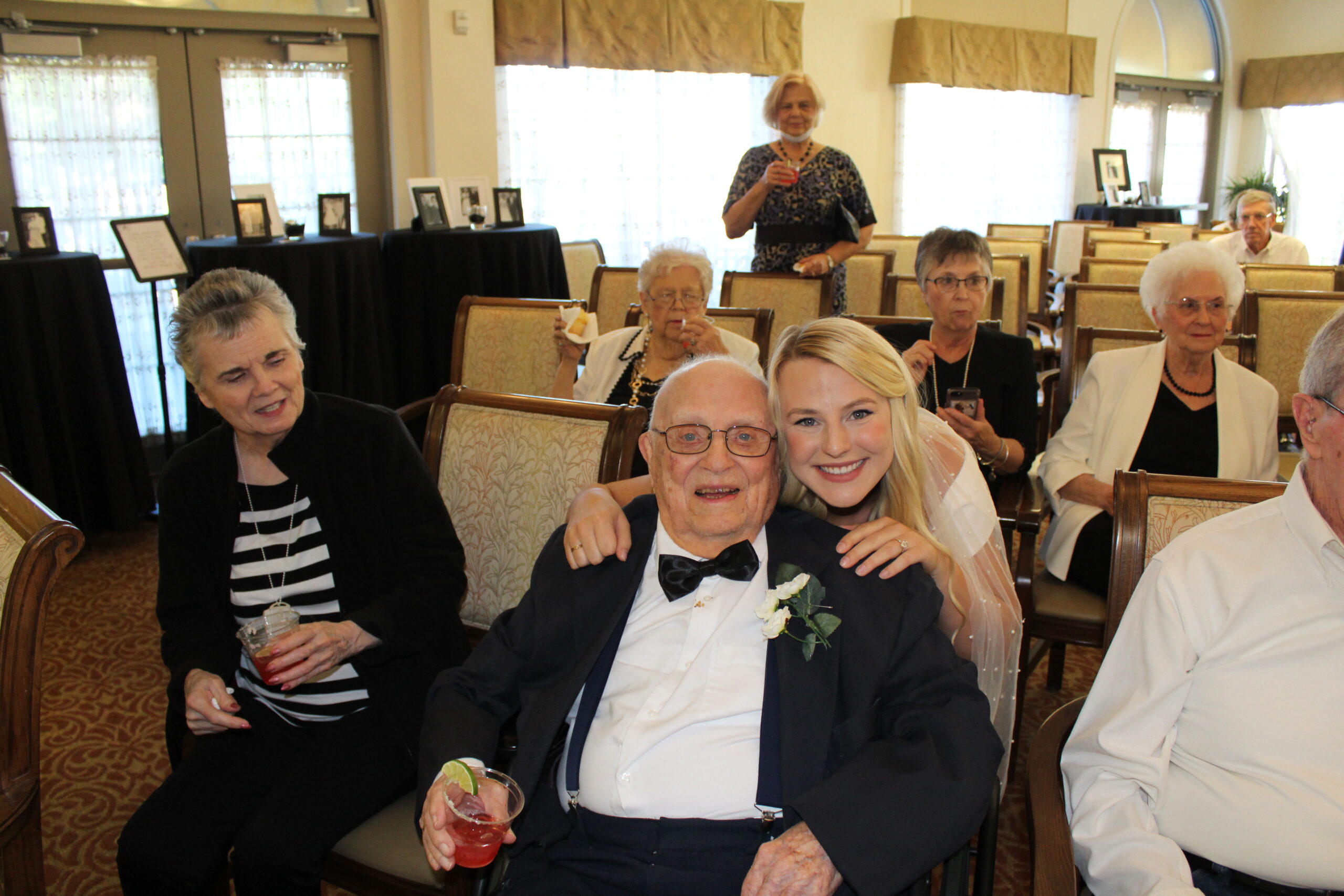 a concordia resident posing with marketing coordinator Charli Kroeker at her wedding reception at concordia