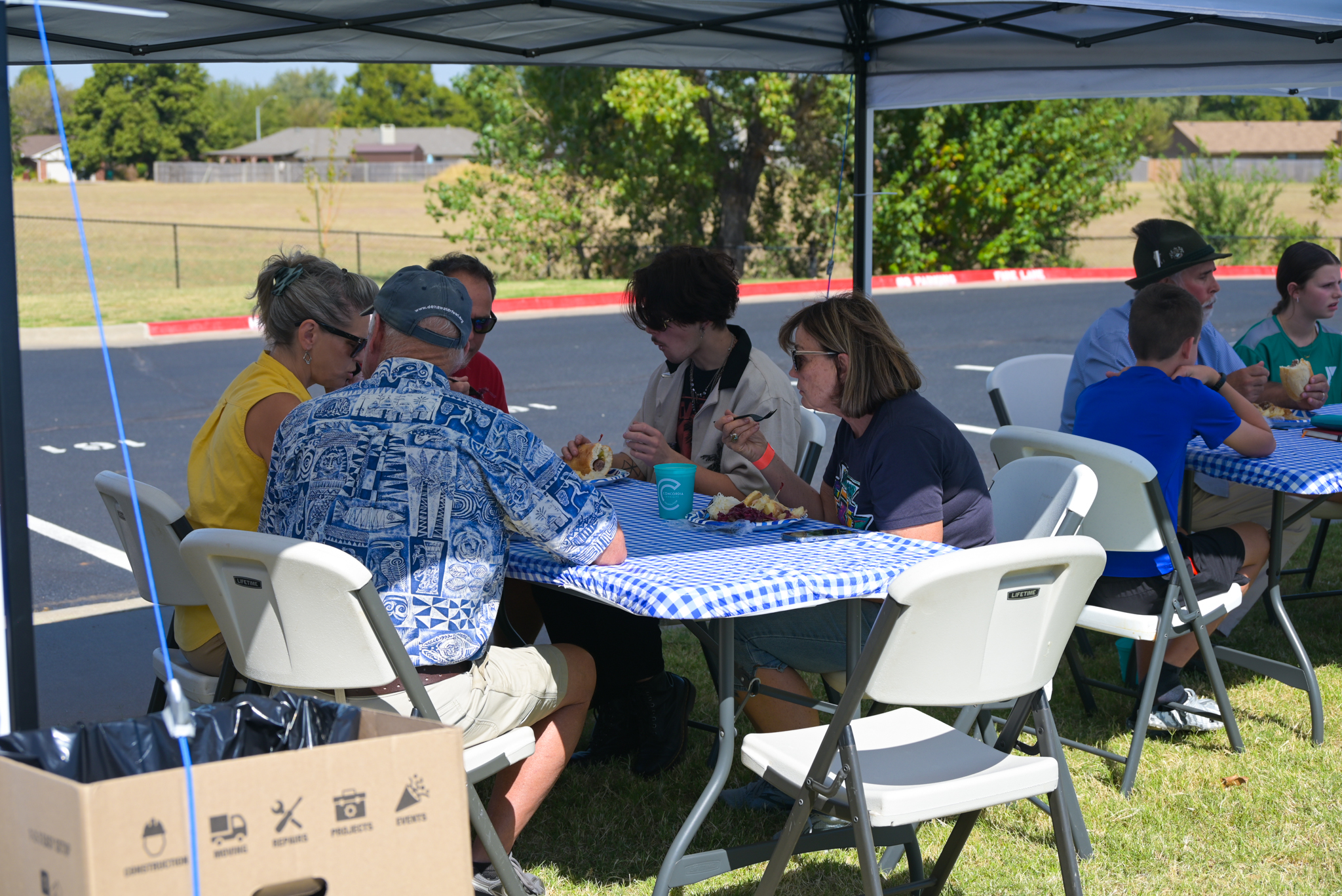 a group of people sitting around a table and eating