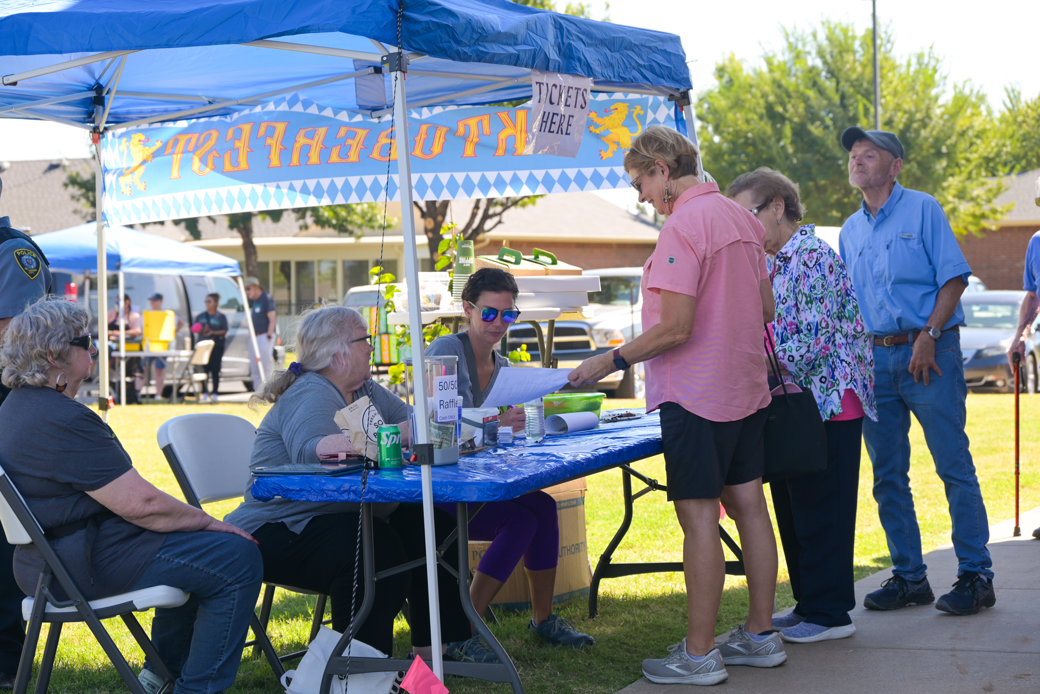 three concordia employees selling tickets to three attendees